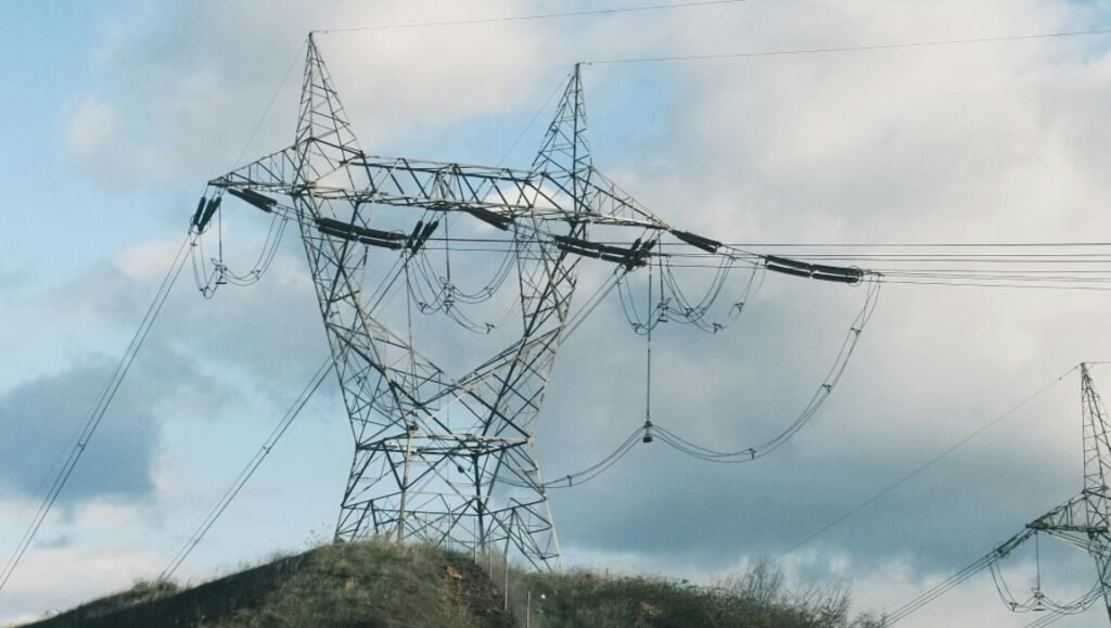 Transmission tower with ADSS cables installed near high-voltage power lines