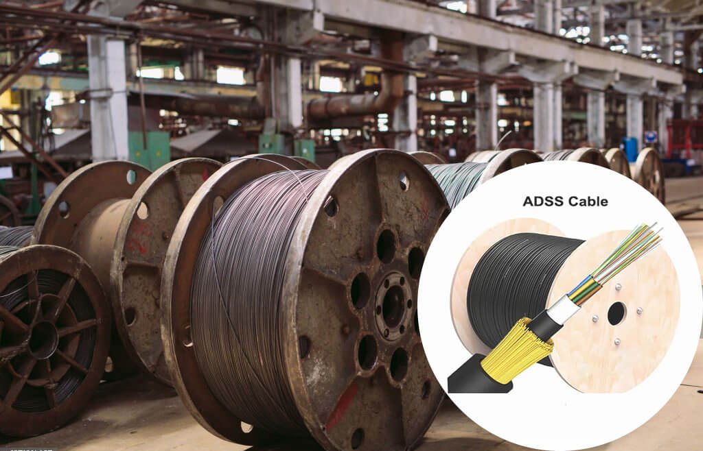 Large spools of ADSS cables inside an industrial factory.