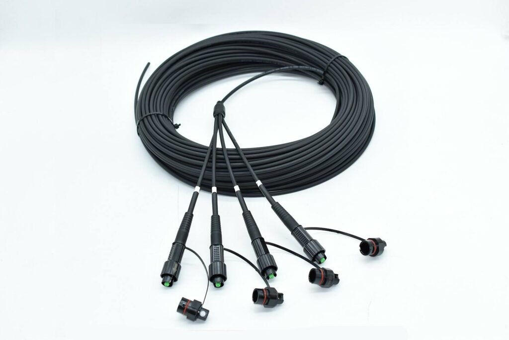 Coiled FTTA patch cord with multiple fiber optic connectors