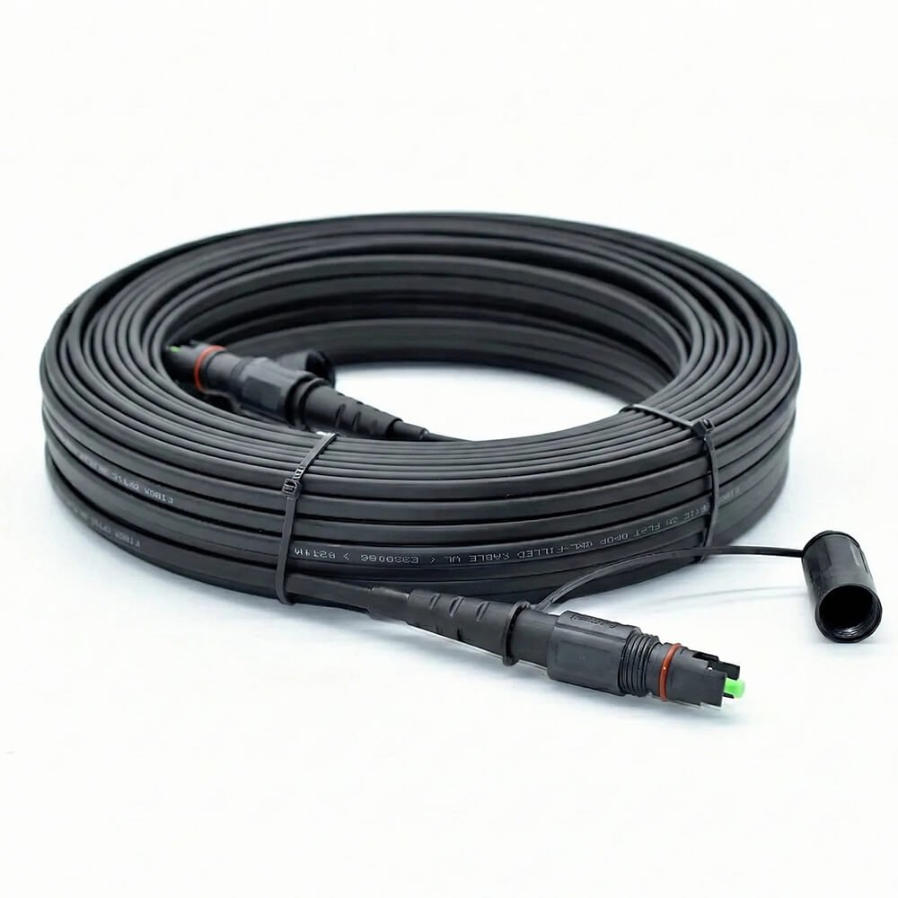 Toneable Flat Drop Cable Assembly – Hardened SCAPC (OptiTap Compatible) Toneable flat drop fiber optic cable assembly with hardened SC/APC connector, OptiTap compatible, for direct burial and aerial FTTH drops